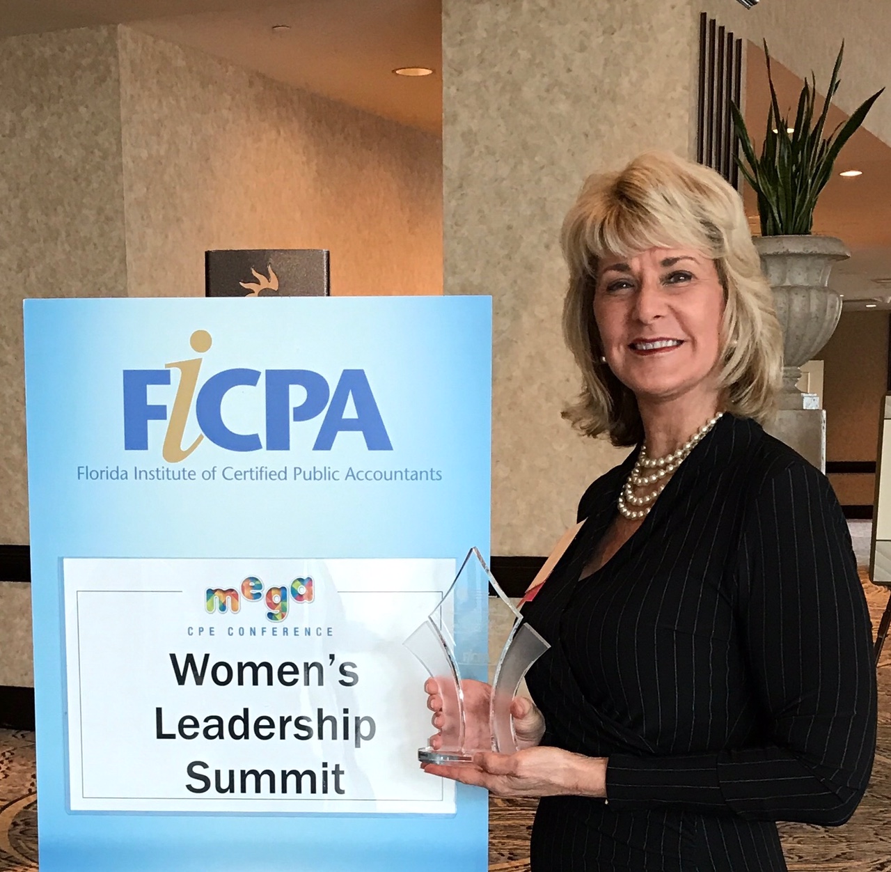Gail with Award for FICPA